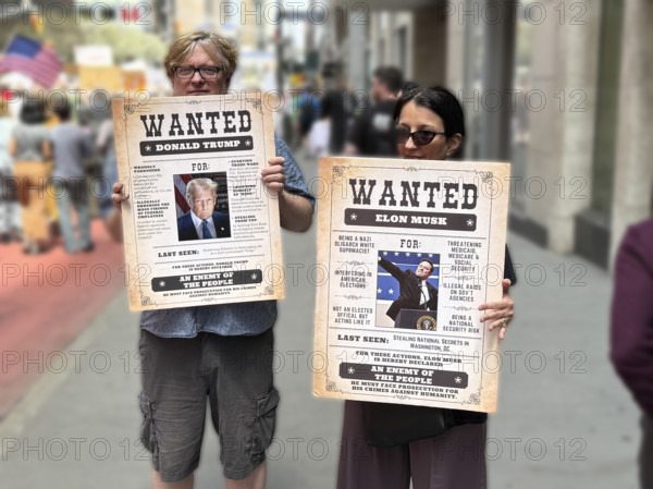 Demonstrators participating in "Our City, Our Fight: Protect Migrants, Protect the Planet" protest, New York City, New York, April 19, 2025