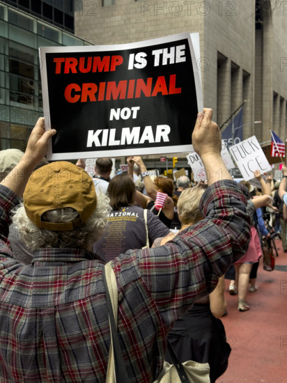 Demonstrators participating in "Our City, Our Fight: Protect Migrants, Protect the Planet" protest, New York City, New York, April 19, 2025