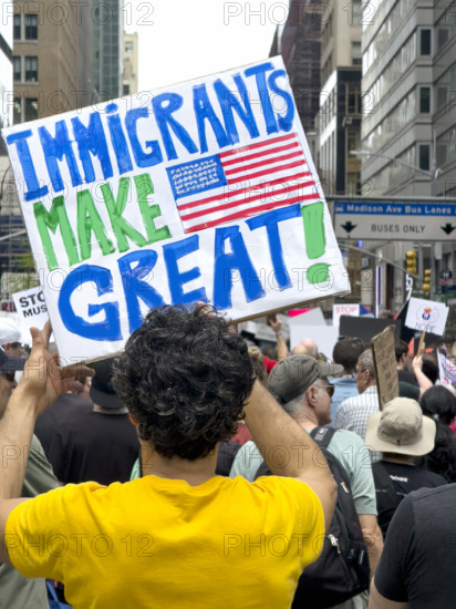Demonstrators participating in "Our City, Our Fight: Protect Migrants, Protect the Planet" protest, New York City, New York, April 19, 2025