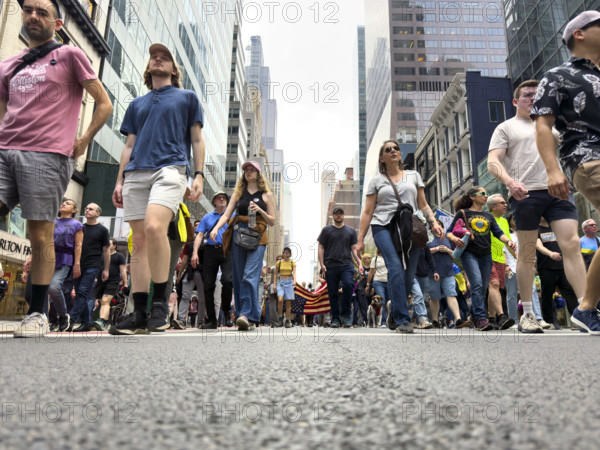 Demonstrators participating in "Our City, Our Fight: Protect Migrants, Protect the Planet" protest, New York City, New York, April 19, 2025