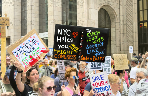 Demonstrators participating in "Our City, Our Fight: Protect Migrants, Protect the Planet" protest, New York City, New York, April 19, 2025