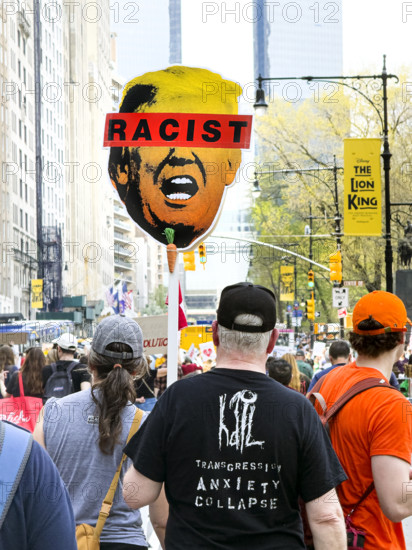 Demonstrators participating in "Our City, Our Fight: Protect Migrants, Protect the Planet" protest, New York City, New York, April 19, 2025