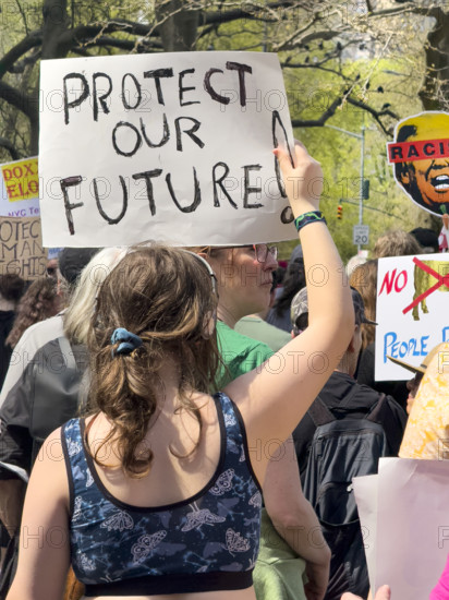 Demonstrators participating in "Our City, Our Fight: Protect Migrants, Protect the Planet" protest, New York City, New York, April 19, 2025