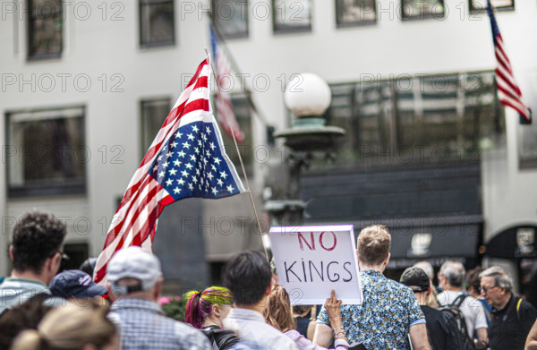 Demonstrators participating in "Our City, Our Fight: Protect Migrants, Protect the Planet" protest, New York City, New York, April 19, 2025
