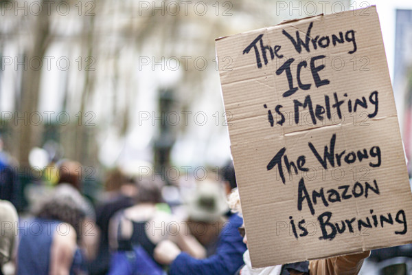 Demonstrators participating in "Our City, Our Fight: Protect Migrants, Protect the Planet" protest, New York City, New York, April 19, 2025