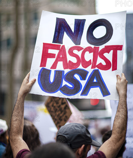 Demonstrators participating in "Our City, Our Fight: Protect Migrants, Protect the Planet" protest, New York City, New York, April 19, 2025
