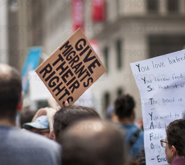 Demonstrators participating in "Our City, Our Fight: Protect Migrants, Protect the Planet" protest, New York City, New York, April 19, 2025