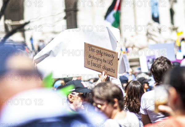Demonstrators participating in "Our City, Our Fight: Protect Migrants, Protect the Planet" protest, New York City, New York, April 19, 2025