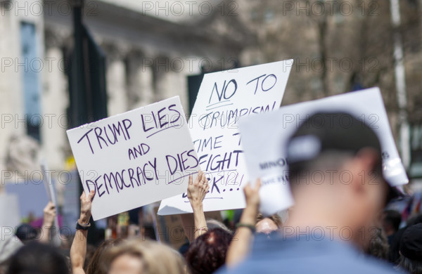 Demonstrators participating in "Our City, Our Fight: Protect Migrants, Protect the Planet" protest, New York City, New York, April 19, 2025