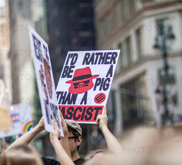 Demonstrators participating in "Our City, Our Fight: Protect Migrants, Protect the Planet" protest, New York City, New York, April 19, 2025