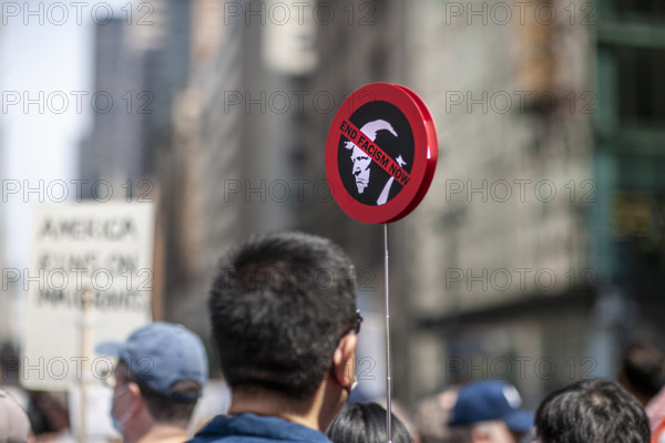 Demonstrators participating in "Our City, Our Fight: Protect Migrants, Protect the Planet" protest, New York City, New York, April 19, 2025