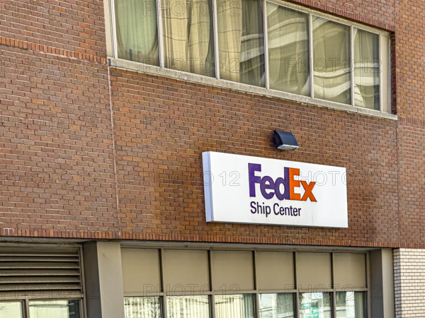 FedEx shipping center, building exterior with logo sign, New York City, New York, USA