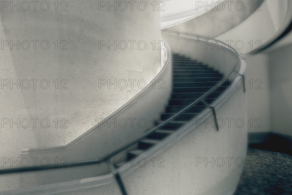 Curved staircase inside commercial building