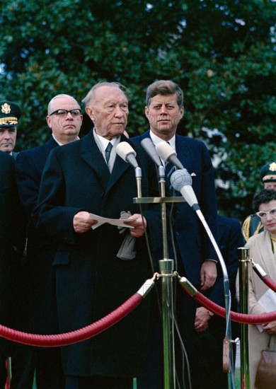 U.S. President John F. Kennedy looking on as Chancellor of West Germany, Dr. Konrad Adenauer, delivers remarks during arrival ceremonies in his honor, South Lawn, White House, Washington, D.C., USA, Robert Knudsen, White House Photographs, November 14, 1962
