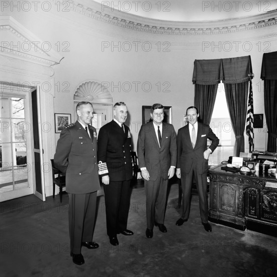 U.S. President John F. Kennedy (2nd right) meeting with Chief of the Defense Staff of British Armed Forces and Admiral of the Fleet, Lord Louis Mountbatten, First Earl Mountbatten of Burma (second left), Chairman of the Joint Chiefs of Staff, General Maxwell D. Taylor (left), and Ambassador of Great Britain, Sir David Ormsby-Gore (right), Oval Office, White House, Washington, D.C., USA, Cecil W. Stoughton, White House Photographs, February 6, 1963