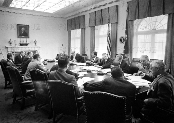 Executive Committee of the National Security Council (Clockwise from top right side of table: Under Secretary of State George Ball, Secretary of State Dean Rusk, U.S. President John F. Kennedy, Secretary of Defense Robert S. McNamara, Deputy Secretary of Defense Roswell Gilpatric, Chairman of the Joint Chiefs of Staff General Maxwell D. Taylor, Assistant Secretary of Defense for International Security Affairs Paul Nitze, Acting Director of the United States Information Agency Donald Wilson, Special Counsel to the President Theodore C. Sorensen, Special Assistant to the President for National Security McGeorge Bundy (mostly hidden), Secretary of the Treasury C. Douglas Dillon, Vice President Lyndon B. Johnson (mostly hidden), Attorney General Robert F. Kennedy, former U.S. Ambassador to the Soviet Union Llewellyn Thompson, Director of the Arms Control and Disarmament Agency William C. Foster, and Director of the Central Intelligence Agency (CIA) John McCone (mostly hidden behind Directo...