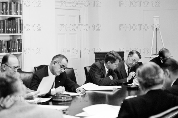 Executive Committee of the National Security Council (clockwise from bottom left): Chairman of the Joint Chiefs of Staff General Maxwell D. Taylor, Secretary of the Treasury C. Douglas Dillon, U.S. Vice President Lyndon B. Johnson, Attorney General Robert F. Kennedy, former U.S. Ambassador to the Soviet Union Llewellyn Thompson, Director of the Arms Control and Disarmament Agency William C. Foster, Secretary of Defense Robert S. McNamara, and Deputy Secretary of Defense Roswell Gilpatric in the cabinet room during meeting with U.S. President John F. Kennedy regarding the crisis in Cuba, White House, Washington, D.C., USA, Cecil W. Stoughton, White House Photographs, October 29, 1962