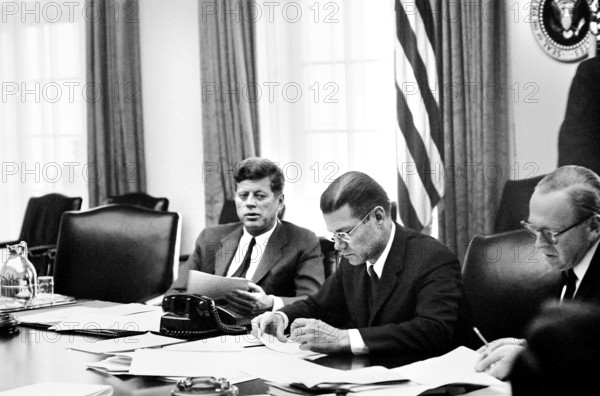 U.S. President John F. Kennedy with U.S. Secretary of Defense Robert S. McNamara (center) and Deputy Secretary of Defense Roswell Gilpatric (right) in the cabinet room during meeting wit the Executive Committee of the National Security Council regarding the crisis in Cuba, White House, Washington, D.C., USA, Cecil W. Stoughton, White House Photographs, October 29, 1962