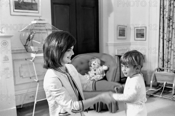 U.S. First Lady Jacqueline Kennedy playing with her son, John F. Kennedy, Jr., in John’s nursery, following a joint birthday party for him and his sister, Caroline Kennedy, White House, Washington, D.C., USA, Cecil W. Stoughton, White House Photographs, November 27, 1962