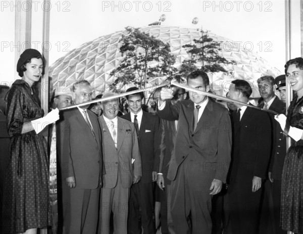 U.S. Vice President Richard M. Nixon cutting ceremonial ribbon at the opening of the American Exhibition at Sokolniki Park, as Soviet Premier Nikita Khrushchev, Soviet First Deputy Premier Frol Kozlov, and U.S. Ambassador to the Soviet Union Llewellyn Thompson look on, Moscow, Soviet Union, White House Photo Office, July 27, 1959