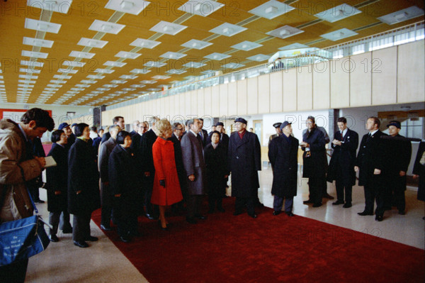 U.S. President Richard M. Nixon and U.S. First Lady Pat Nixon walk with Chinese Delegation into an Airport Terminal at Hang Chiao airport upon arrival at Shanghai, China, White House Photo Office, February 27, 1972