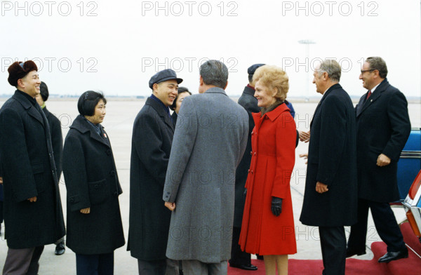 U.S. President Richard M. Nixon and U.S. First Lady Pat Nixon and accompanying party are greeted by official Chinese Delegation upon arrival at Hang Chiao airport, Shanghai, China, White House Photo Office, February 27, 1972