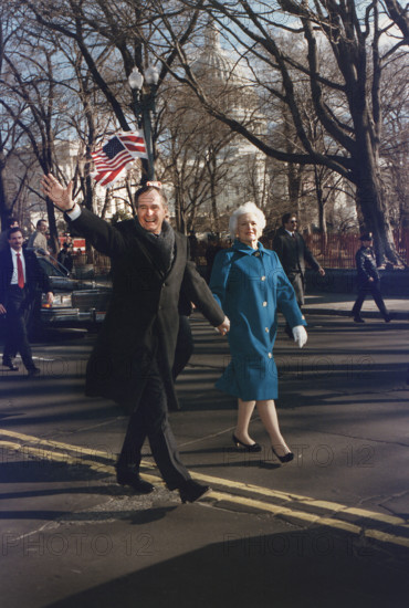 U.S. President George H.W. Bush and U.S. First Lady Barbara Bush walking along Pennsylvania Avenue after the President's Inauguration, Washington, D.C., USA, David Valdez, White House photographer, January 20, 1989