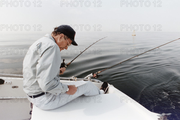 U.S. President George H.W. Bush fishing off the coast of Kennebunkport, Maine, USA, Susan Biddle, White House photographer, August 16, 1990