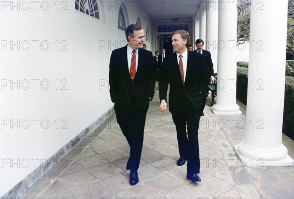 U.S. President George H.W. Bush walking along the colonnade with U.S. Vice President Quayle enroute to Oval Office, White House, Washington, D.C., USA, David Valdez, White House photographer, March 20, 1992