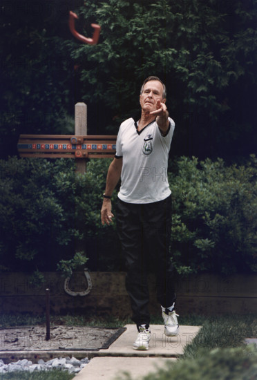 U.S. President George H.W. Bush participating in annual horseshoe tournament at the White House horseshoe pit, Washington, D.C., USA, David Valdez, White House photographer, June 24, 1992