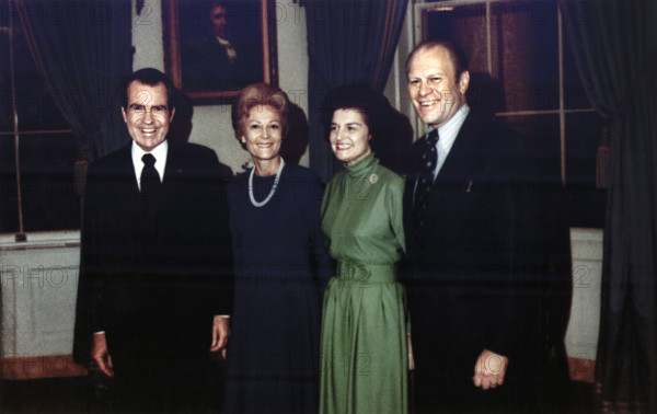 U.S. President Richard M. Nixon and U.S. First Lady Pat Nixon with Representative Gerald R. Ford and Betty Ford in the Blue Room of the White House, Following the Nomination of Gerald Ford as Vice President, Washington, D.C., USA, White House Photo Office, October 12, 1973