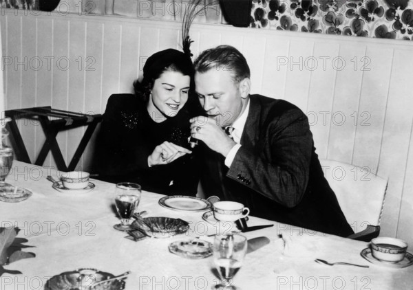 Gerald R. Ford, Jr., and Betty Bloomer Warren at their wedding rehearsal dinner, Grand Rapids, Michigan, USA, White House Photo Office, October 14, 1948