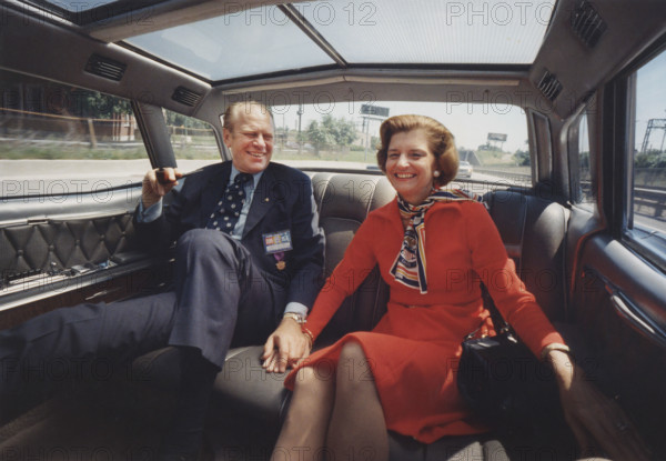 U.S. President Gerald Ford and U.S. First Lady Betty Ford holding hands while riding in the President's limousine, Chicago, Illinois, USA, David Hume Kennerly, White House photographer, August 19, 1974