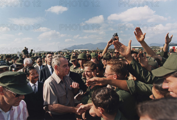 U.S. President Lyndon Johnson shaking hands in a crowd of U.S. troops, Cam Ranh Bay, Vietnam, Yoichi R. Okamoto, White House photographer, December 23, 1967