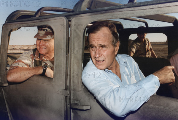 U.S. President George H.W. Bush riding in HUMVEE with U.S. General H. Norman Schwarzkopf during his visit with troops on Thanksgiving Day, Saudi Arabia, David Valdez, White House photographer, November 22, 1990