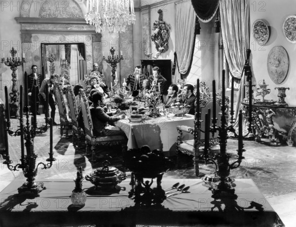 Akim Tamiroff (sitting at the head of the table), on-set of the film, "The Corsican Brothers", United Artists, 1941