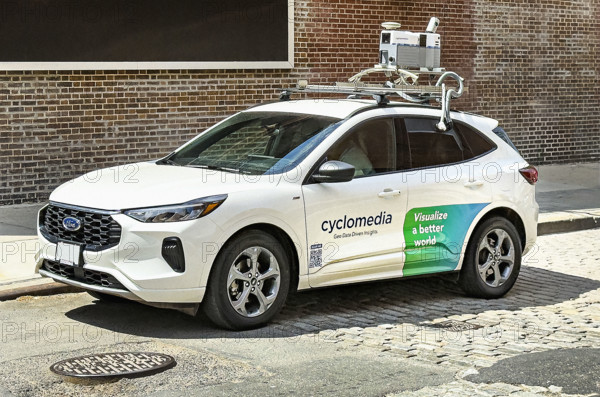 Cyclomedia car with camera equipment on roof used for capturing visual data from public spaces, New York City