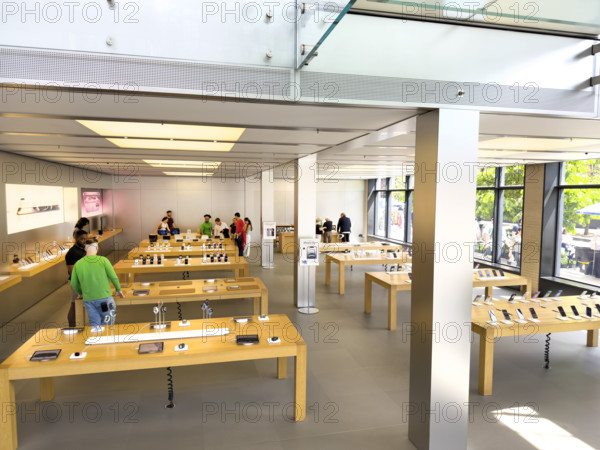 Customers shopping in Apple Store, West 14th Street, New York City