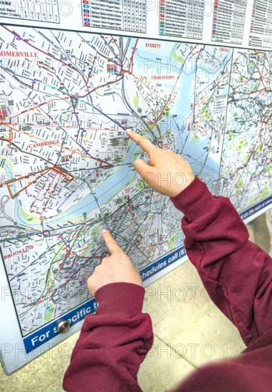 Fingers pointing at outdoor city map, Boston