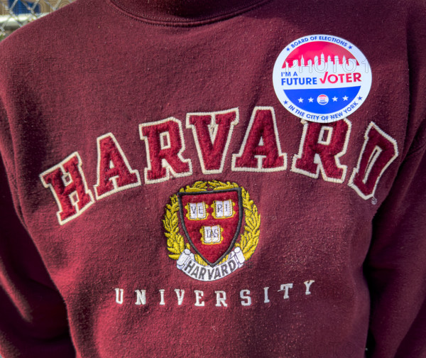 I voted sticker on a Harvard Sweatshirt