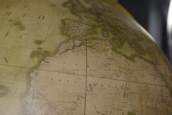 West Africa and Sahara Desert on vintage globe with Mediterranean Sea and Western Europe above, Atlantic Ocean on left