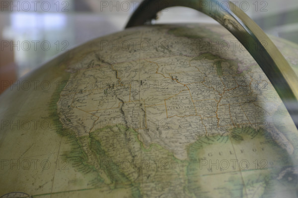 Western and Central United States on vintage globe with Mexico, Baja Mexico, and Gulf of Mexico at bottom, Pacific Ocean on right, Canada on top