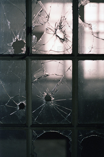 Broken window panes in abandoned building