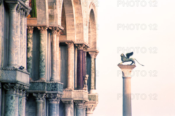 Column of San Marco is depicted with its winged lion, St. Mark's Square, Venice, Italy