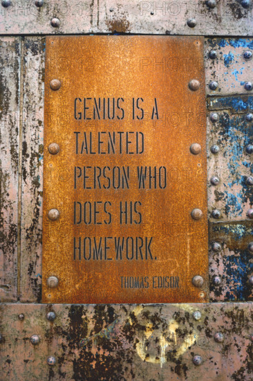 Thomas Edison quote engraved on rusted iron panel