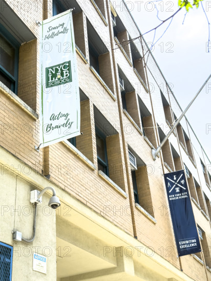 Banners hanging from building exterior for NYC lab School for Collaborative Studies and NYC Museum School, 333 West 17th Street, Chelsea, Manhattan, New York City, New York, USA