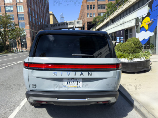 Rear view of Rivian electric SUV and showroom exterior, 461 West 14th Street, Meatpacking District, Manhattan, New York City, New York, USA