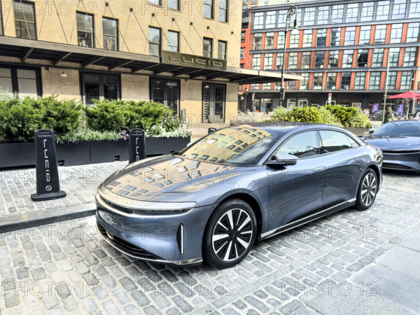 Lucid Studio showroom exterior and Lucid electric vehicle parked on street, 2 9th Avenue, Meatpacking District, Manhattan, New York City, New York, USA