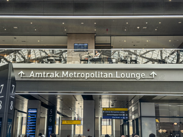 Direction sign for Amtrak Metropolitan Lounge, Moynihan Train Hall, Pennsylvania Station, Manhattan, New York City, New York, USA