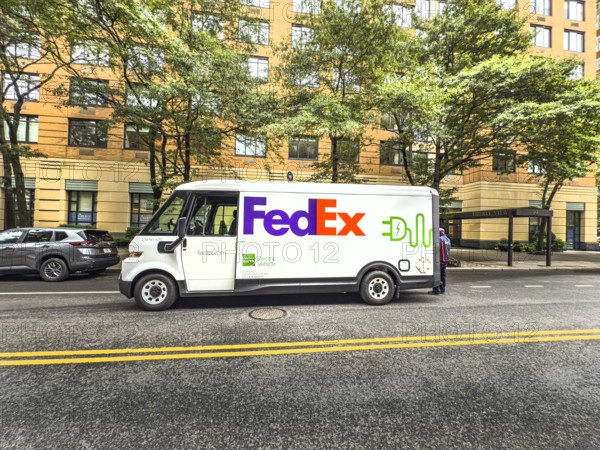 Federal Express electric delivery truck and street scene, Manhattan, New York City, New York, USA